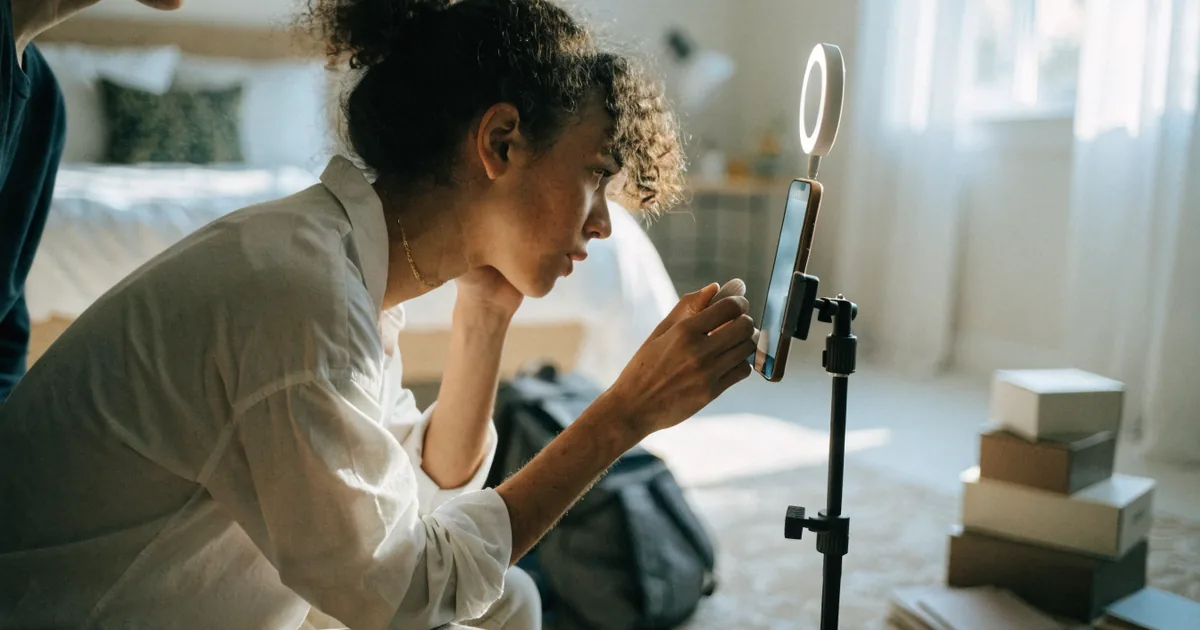Creator filming a product demo on a tripod — tiktok shop fee calculator for referral fees